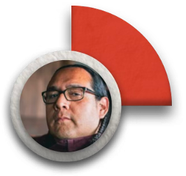 a portrait of a person, Oscar Hokeah, with glasses, braided hair, and a stoic expression