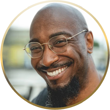 A close-up of a person, Phillip B. Williams, inside a gold ring